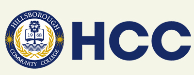 Logo of Hillsborough Community College (HCC). The circular emblem features an open book with "1968" in the center, encircled by golden laurel branches and the name "Hillsborough Community College." To the right, large blue letters "HCC" are displayed.